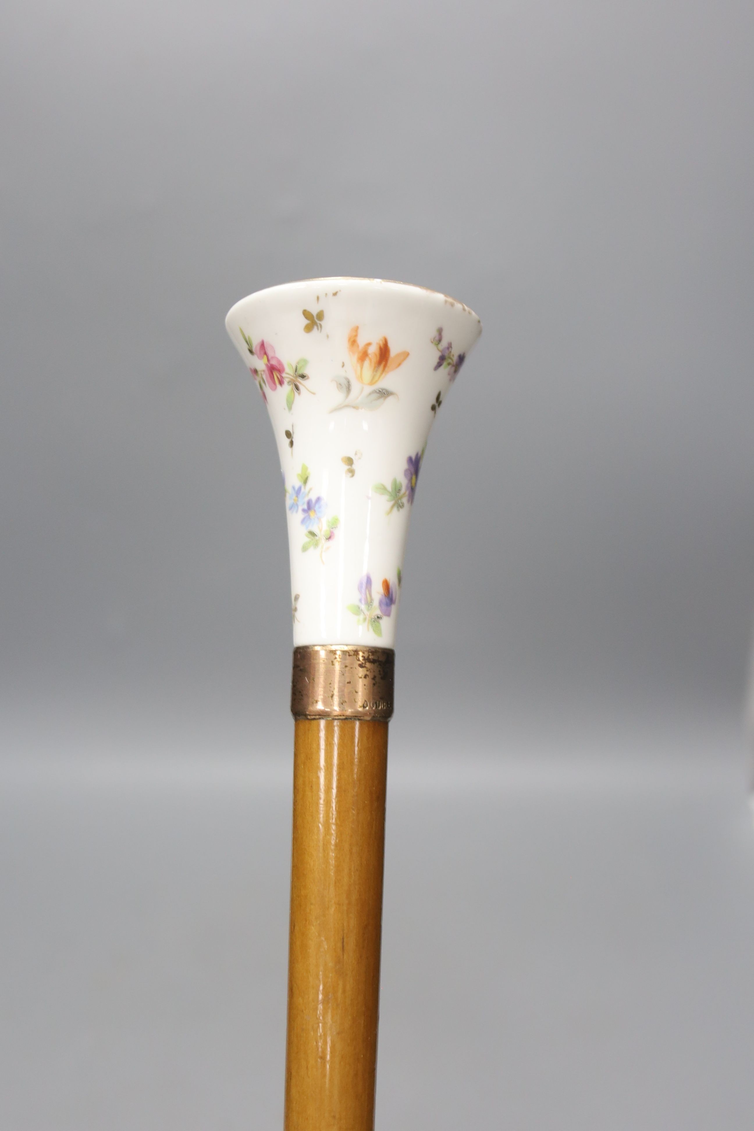 A parasol with a Continental painted porcelain handle 88cm